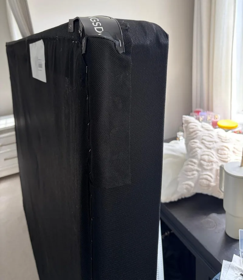 After: Box spring: torn corner fabric repaired