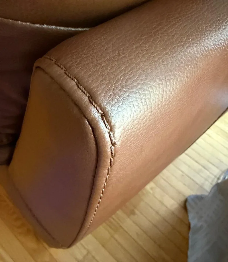 After: Leather armrest: corner chip repair