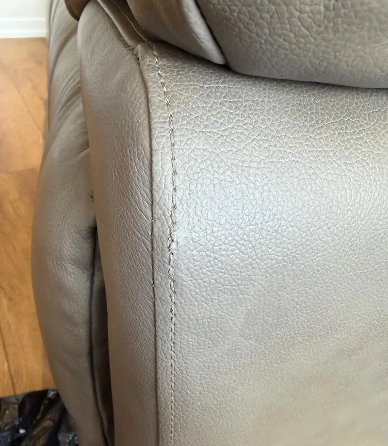 After: Leather armrest: scuffed seam restored