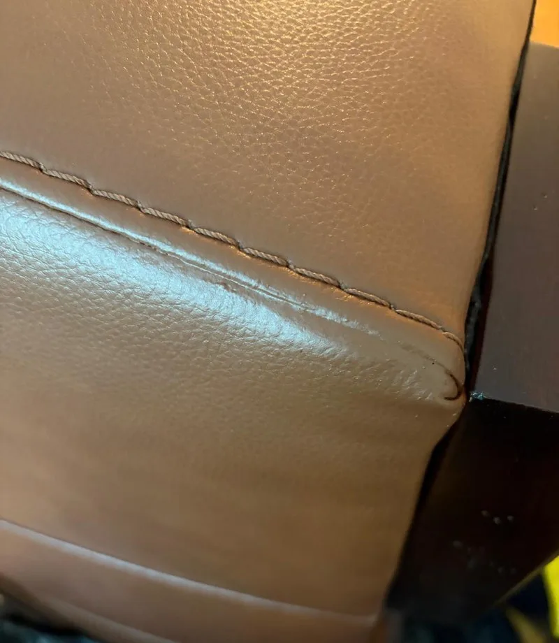 After: Sofa base: torn corner repaired