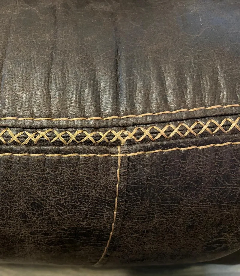 After: Leather cushion: broken stitching redone